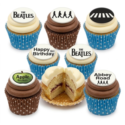 A selection of The Beatles themed cupcakes with vanilla and chocolate frosting, featuring edible toppers of the band's logo, Abbey Road crossing, and Apple Records logo, in blue polka dot cases.