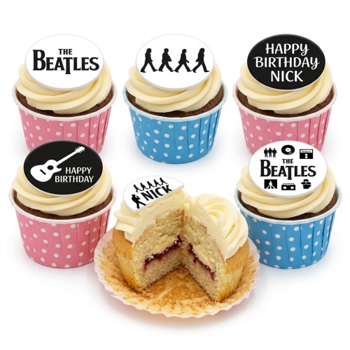 The Beatles themed cupcakes with white frosting, black and white edible toppers, and polka dot cases.