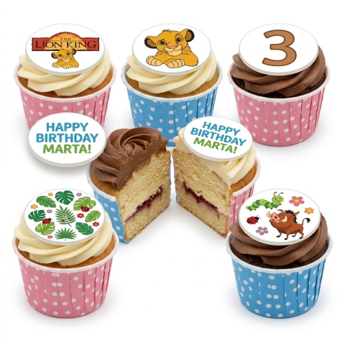 The Lion King themed cupcakes with Simba, Pumbaa, jungle leaves, and custom age/message toppers in pink and blue cases.