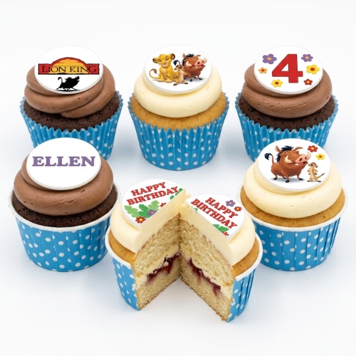 Six Lion King themed birthday cupcakes with character toppers, a custom age topper, and a personalised name topper on chocolate and vanilla cupcakes in blue polka dot cases.