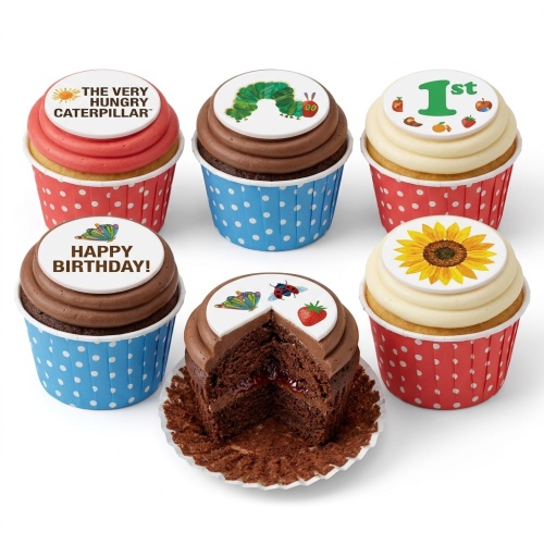 A set of The Very Hungry Caterpillar themed cupcakes with various edible toppers including the caterpillar, butterfly, sunflower, and 'Happy Birthday' message.