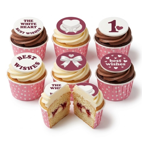 Cupcakes with pink polka dot cases, white and chocolate frosting, topped with edible maroon and white hearts, bows, a heart-shaped box, and messages including 'Best Wishes' and the number '1'.