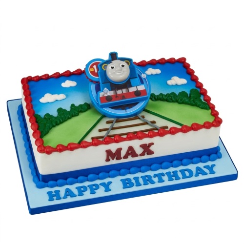 Rectangular Thomas the Tank Engine birthday cake with train tracks, green hills, and blue sky, featuring a Thomas topper.