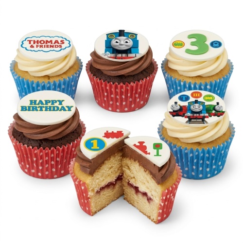 Thomas & Friends themed cupcakes with blue and red cases, featuring Thomas the Tank Engine, "Happy Birthday" and age toppers.