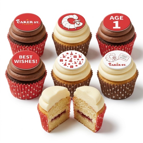 Kids birthday cupcakes with red and white edible toppers, featuring a caterpillar and party hats.