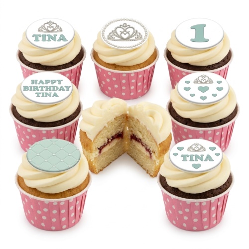 Cupcakes with white frosting in pink polka dot cases, topped with silver tiaras, hearts, and a quilted pattern. Includes a custom age topper and personalised name example.