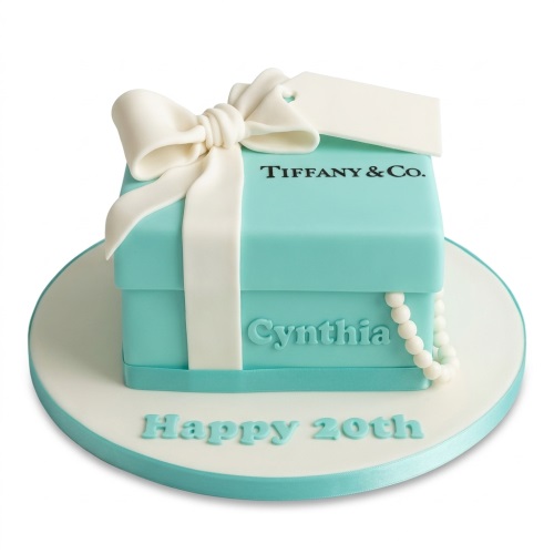 Tiffany blue gift box birthday cake with white bow, pearls, and a custom message.