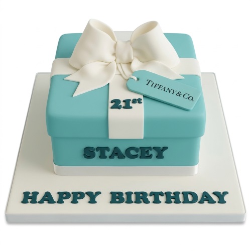 Teal gift box birthday cake with white bow, custom age ribbon, and personalised name.