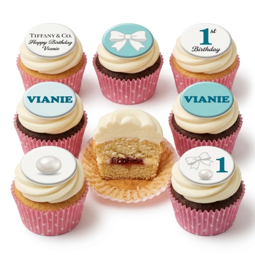 Tiffany style birthday cupcakes with white bows, pearls, and custom age toppers.