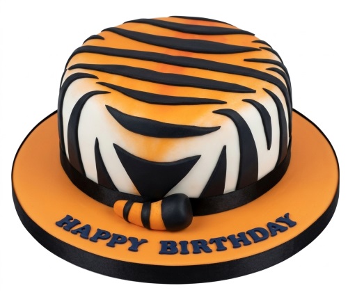 Round cake decorated with orange and black tiger stripes, black ribbon, and "Happy Birthday" message.