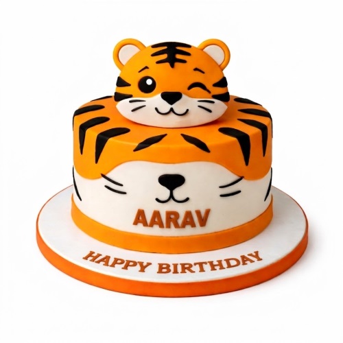 Round orange and white tiger theme birthday cake with 3D winking tiger head topper and personalised name.