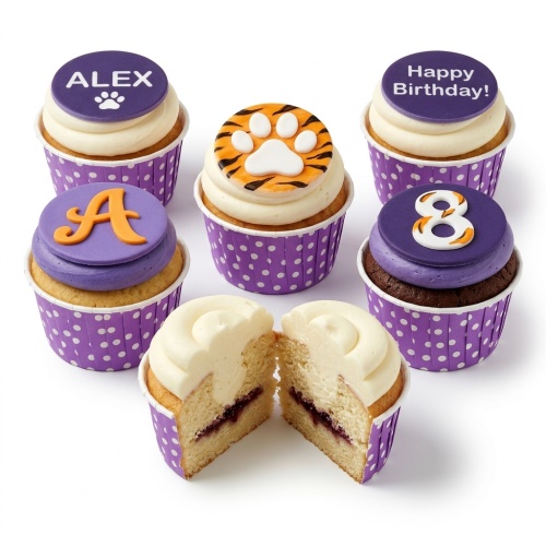 Assorted cupcakes with purple and orange frosting, featuring a tiger paw print, initial, and custom age topper.