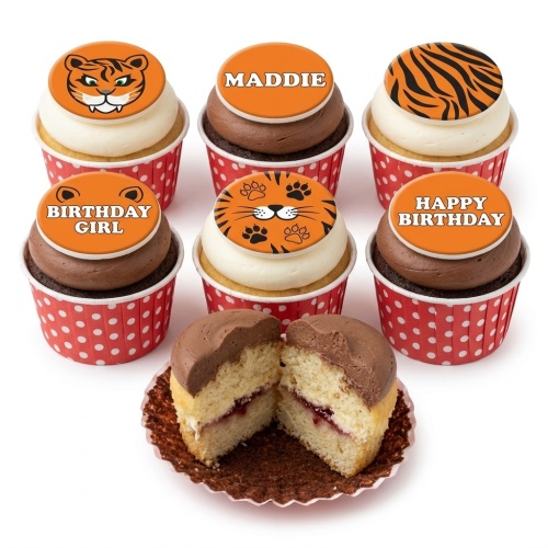 Tiger themed cupcakes with various tiger face, paw print, and stripe toppers in red polka dot cases.