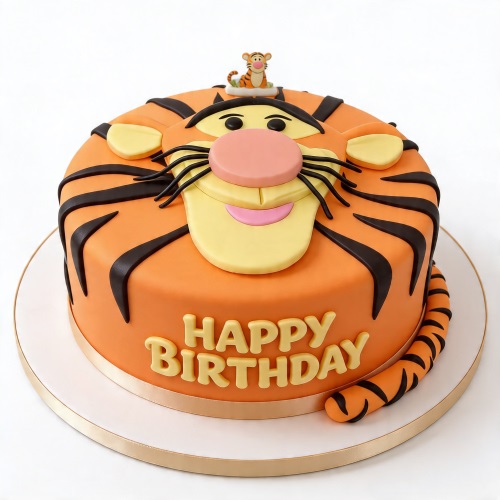 Round orange Tigger face birthday cake with black stripes and a small Tigger figurine.
