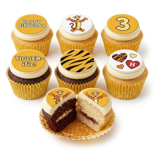 Tigger themed cupcakes with Tigger character, stripes, 'Happy Birthday', 'TIGGER-ific!', custom age '3', and initial 'H' toppers.