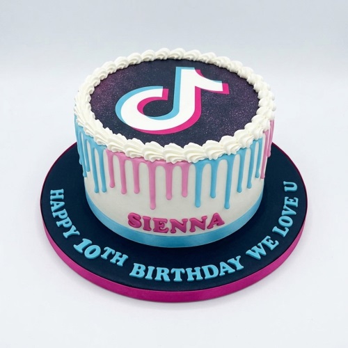 Round TikTok themed birthday cake with pink and blue drip, white icing, and custom age message.