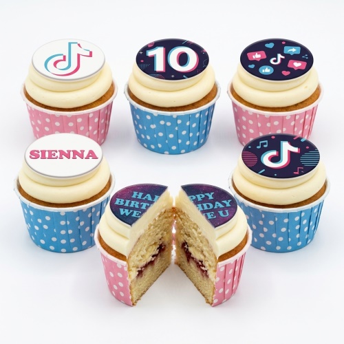 TikTok themed cupcakes with custom age and name toppers, featuring social media icons in pink and blue wrappers.