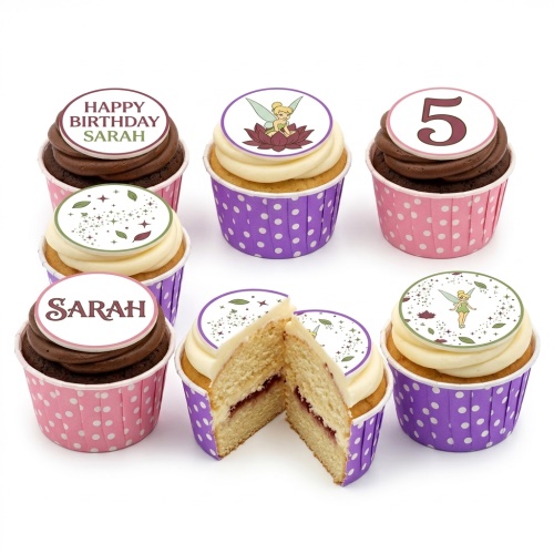 Tinkerbell themed birthday cupcakes with fairy dust designs, some with custom age and name toppers, in pink and purple polka dot cases.