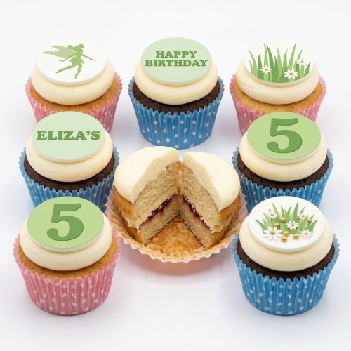 Assortment of fairy garden cupcakes with fairy silhouette, daisies, grass, and custom age toppers.
