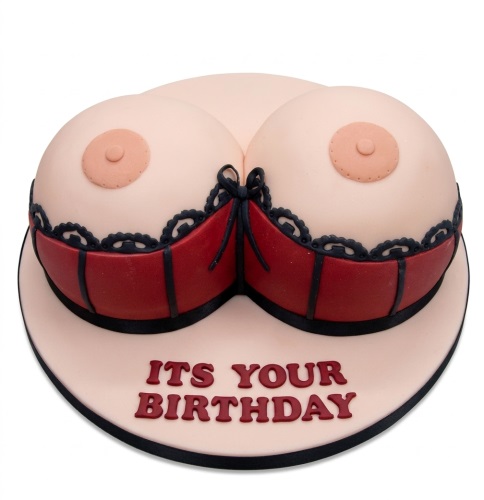Adult novelty boob cake with red bra and black lace trim, 'Its Your Birthday' message.