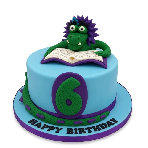 Round light blue cake with a green dragon reading a book and a custom age number.