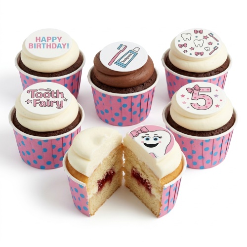 Tooth Fairy themed birthday cupcakes with white and chocolate frosting, pink polka dot cases, and custom age topper.