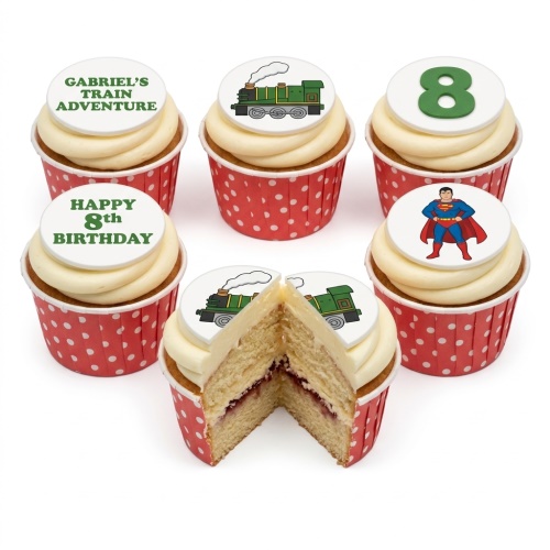 Cupcakes with white frosting, red polka dot wrappers, Superman, train, and custom age toppers.