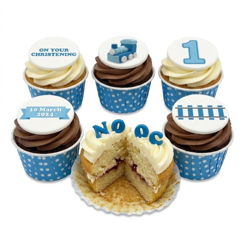 Blue train theme cupcakes for a Christening, featuring train, tracks, and custom age topper.