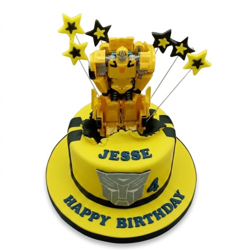 Yellow Transformers Bumblebee cake with star toppers and custom name and age.