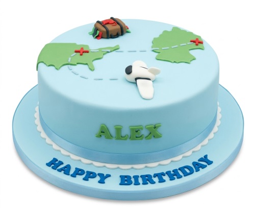 Light blue travel theme birthday cake with world map, aeroplane, and suitcase decorations.