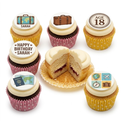 A selection of cupcakes with white frosting and travel-themed edible toppers, including suitcases, a globe, an aeroplane, a compass, a passport, and a map. One cupcake has an 'AGE 18' topper and another a 'HAPPY BIRTHDAY SARAH' topper. One cupcake is cut in half revealing a jam filling.