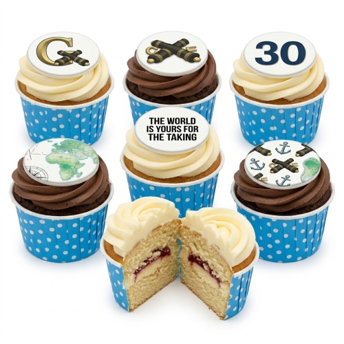 Adventure theme cupcakes with world map, compass, anchor, and telescope toppers, in blue polka dot cases.