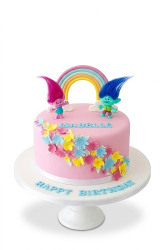 Pink Trolls birthday cake with Poppy and Branch figures, a pastel rainbow, and colourful sugar flowers and butterflies.