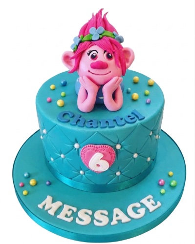 Round turquoise Trolls Poppy birthday cake with quilted design, custom age heart, and colourful sprinkles.