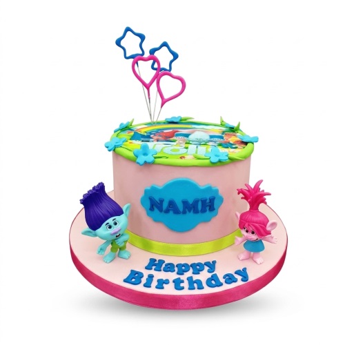 Pink Trolls theme birthday cake with Branch and Poppy figurines, custom name plaque, and 'Happy Birthday' message.