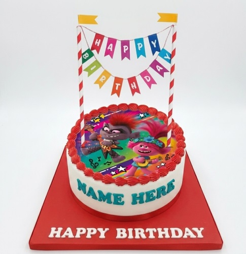 Round white Trolls birthday cake with Poppy and Branch edible image, red piping, and a 'Happy Birthday' banner.