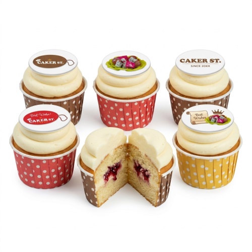 Celebration cupcakes with white frosting, berry filling, and edible fruit and 'Best Wishes' toppers.