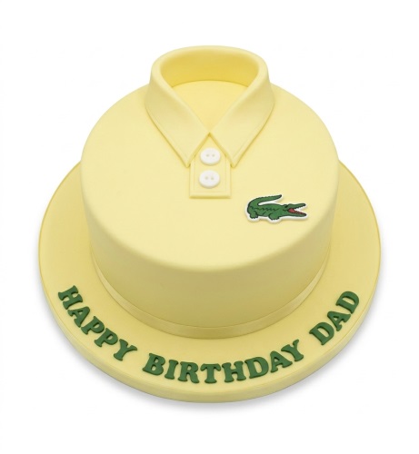 Pale yellow round cake decorated as a Lacoste polo shirt with collar, buttons, and crocodile logo.