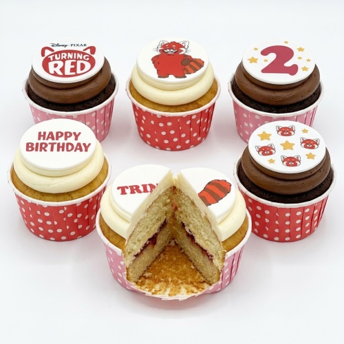 Set of Disney Pixar Turning Red themed cupcakes with Red Panda character and logo toppers, some with custom age and Happy Birthday messages.