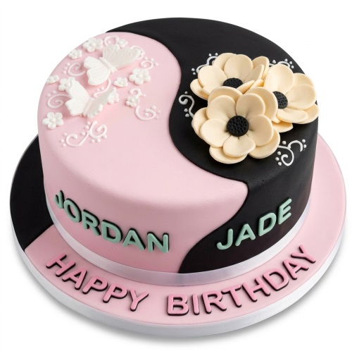 Round pink and black split birthday cake with white butterflies, cream flowers, and white swirls.