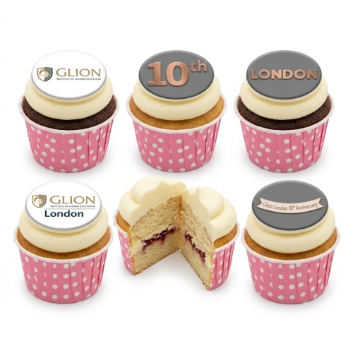 Cupcakes with corporate logo and "10th Anniversary" toppers, in pink polka dot wrappers.