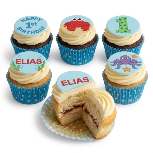 Under the sea themed 1st birthday cupcakes with crab, octopus, and custom name toppers