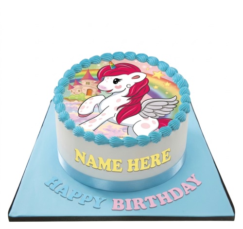 Round white unicorn birthday cake with blue piping, a rainbow, and a castle, on a blue board with a custom name and 'Happy Birthday' message.