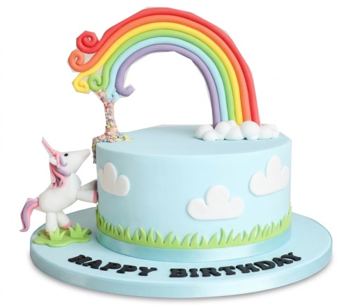 Round blue cake with a white unicorn, colourful rainbow, and white clouds.