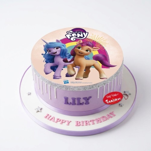 Round purple My Little Pony birthday cake with character topper, glitter, and drip effect, with personalised name and message.