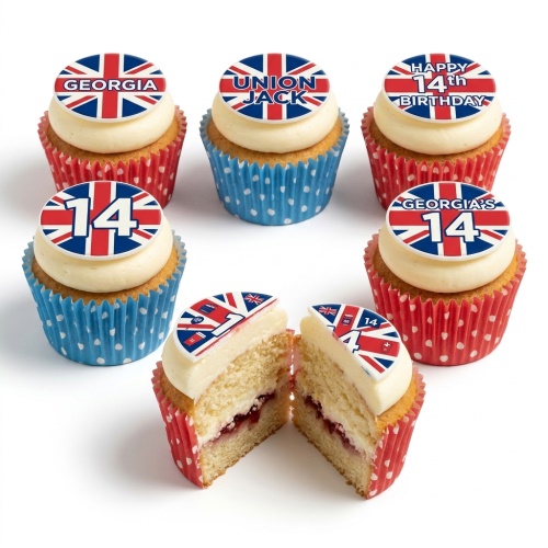 A set of Union Jack themed cupcakes with white frosting and red and blue polka dot cases, some with custom age and name toppers.