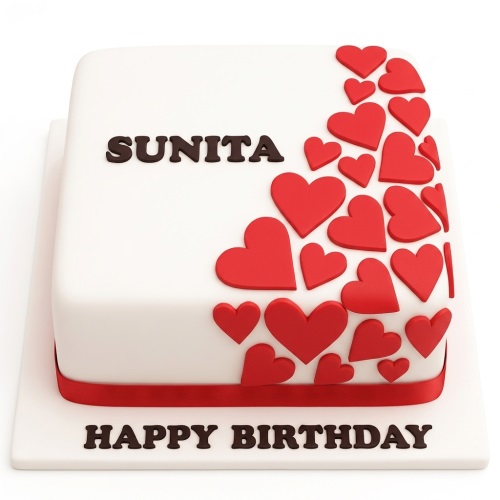 White square birthday cake with red hearts, red ribbon, and custom message.