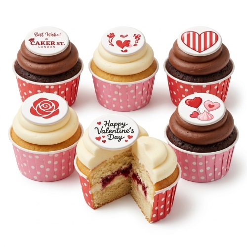 Assortment of Valentine's Day Cupcakes with chocolate and vanilla frosting, decorated with red and white heart and rose toppers, in red polka dot wrappers.