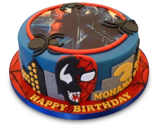 Round blue Spiderman and Venom birthday cake with city buildings and custom age.