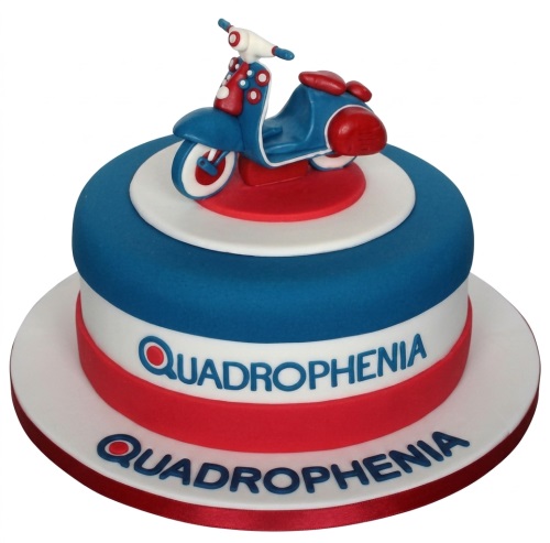 Round red white and blue Quadrophenia cake with a blue and red scooter topper.